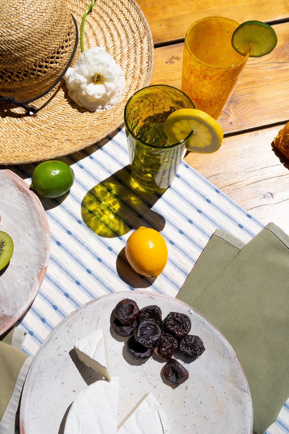 table setting with Brad Smith pint glasses in yellow and green 